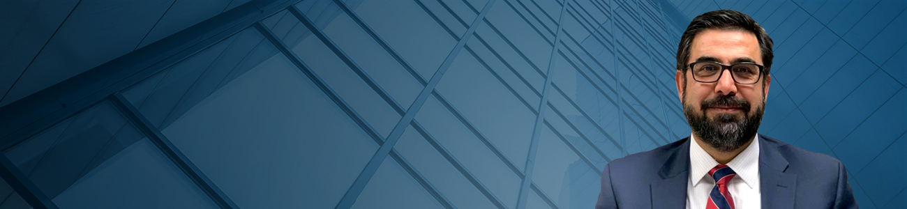Attorney Shafeek Seddiq with a building structure in the background